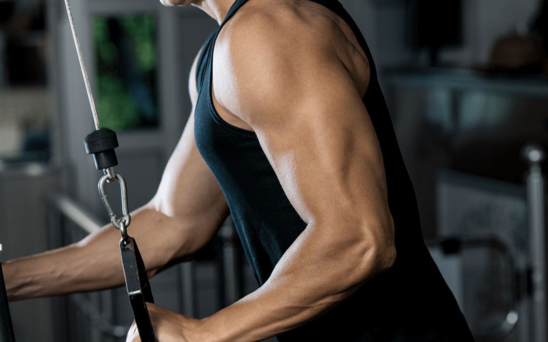 male model showing one arm cable triceps pushdown exercise
