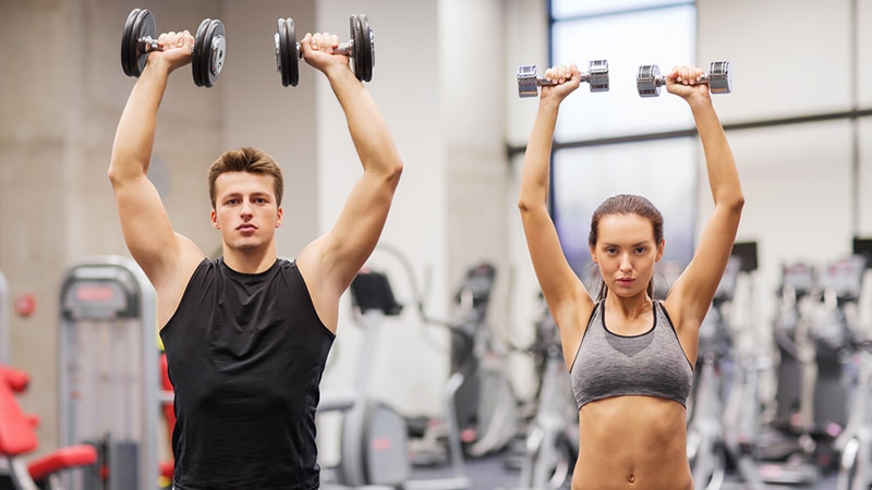 dumbbell shoulder press picture of couple working out
